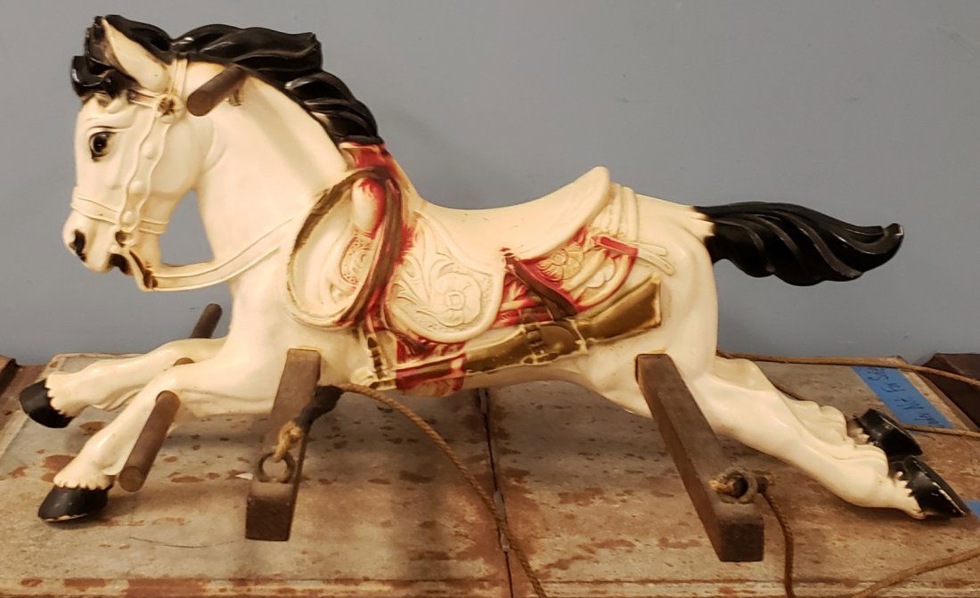 Childs Toy Horse Swing with Gun & Knife: 29" Molded plastic horse swing complete with rope, gun, & knife. Missing some paint. PLEASE READ & UNDERSTAND THE PAYMENTS & SHIPPING TERMS FOR THIS AUCTION PRIOR TO PLACING BIDS. ALL BIDDERS ARE BOUN