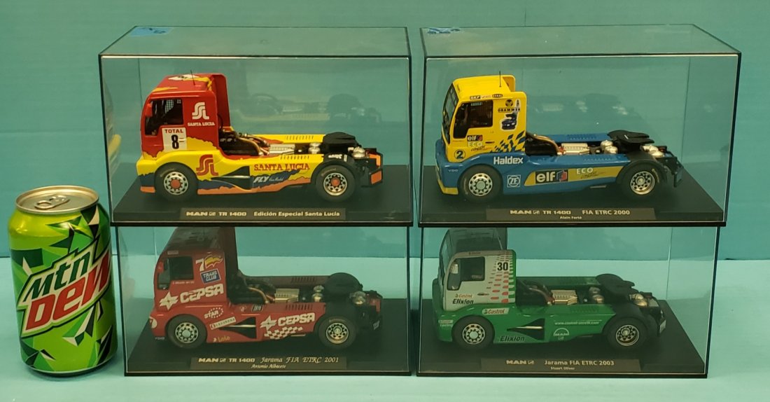 Lot of 4 MAN Fly GB Track Trucks: 4 Fly GB track trucks including MAN TR 1400 Edicion Especial Santa Lucia, MAN TR 1400 Jarama FIA ETRC 2001 Antonio Albacete, MAN TR 1400 FIA ETRC 2000 Alain Ferte, and MAN Jarama FIA ETRC 2003 Stuart 