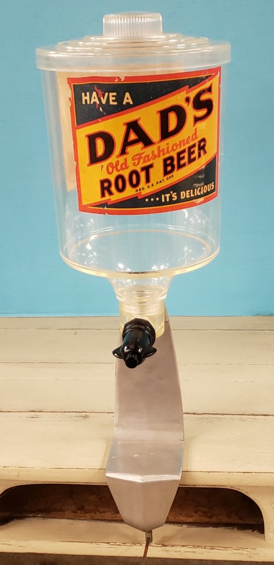 Dad's Root Beer Soda Fountain Syrup Dispenser: 23" Plastic dispenser with aluminum stand that clamps to the countertop. There are 2 Dad's root beer decals on the dispenser as well as a spigot on the soda jerk side. PLEASE READ & UNDERSTAND THE PAY
