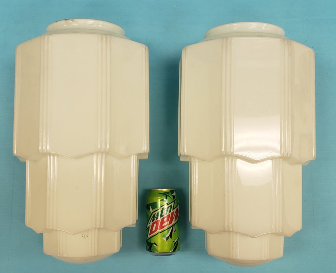 Pair of Art Deco Milk Glass Hanging Shades: Lot of two 16" milk glass skyscraper hanging shades in excellent condition. PLEASE READ & UNDERSTAND THE PAYMENT & SHIPPING TERMS FOR THIS AUCTION PRIOR TO PLACING BIDS. ALL BIDDERS ARE BOUND TO THE T