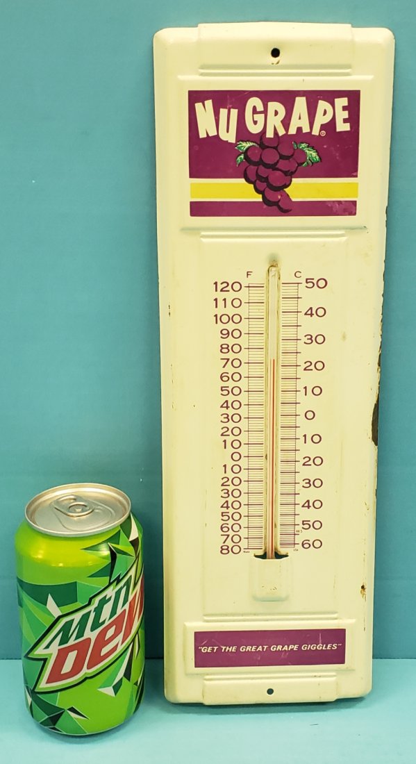 NuGrape Thermometer: 4.5" x 14" tin thermometer with bright colors, minor scuffs, and minor flaking on the edge. PLEASE READ & UNDERSTAND THE PAYMENT & SHIPPING TERMS FOR THIS AUCTION PRIOR TO PLACING BIDS. ALL BIDDERS AR
