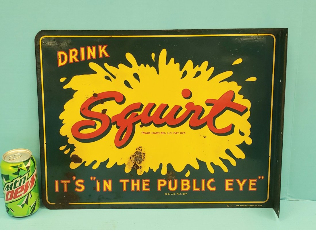 Drink Squirt Flange Sign: 18" x 14" Metal flange sign with bright colors, paint loss, and surface rust. PLEASE READ & UNDERSTAND THE PAYMENT & SHIPPING TERMS FOR THIS AUCTION PRIOR TO PLACING BIDS. ALL BIDDERS ARE BOUND TO THE
