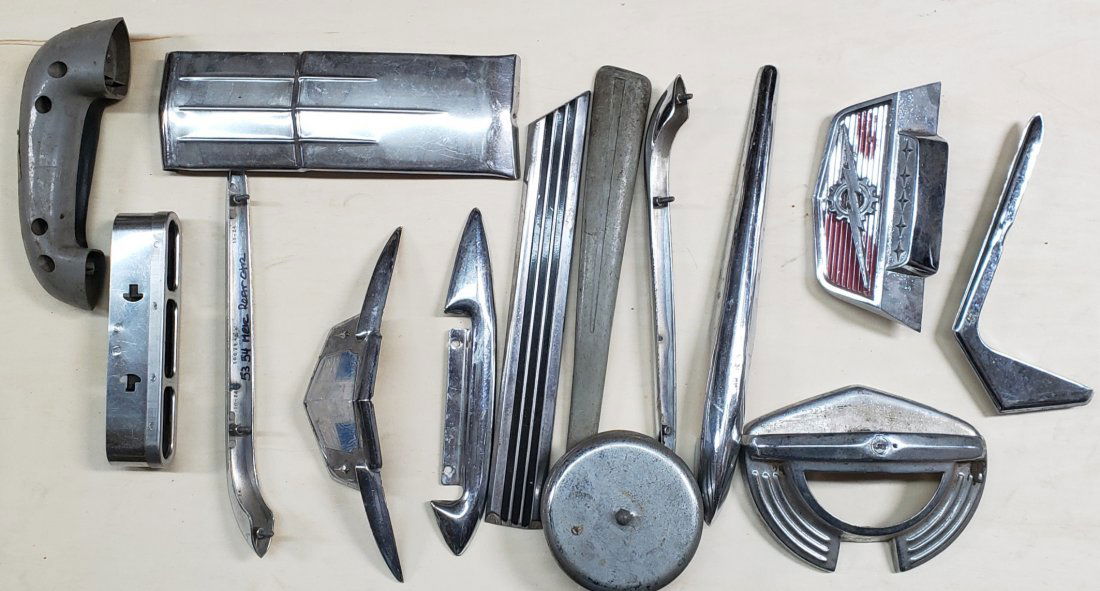 Mixed box lot of assorted trim, badges, ornaments, etc. (1 of 2)