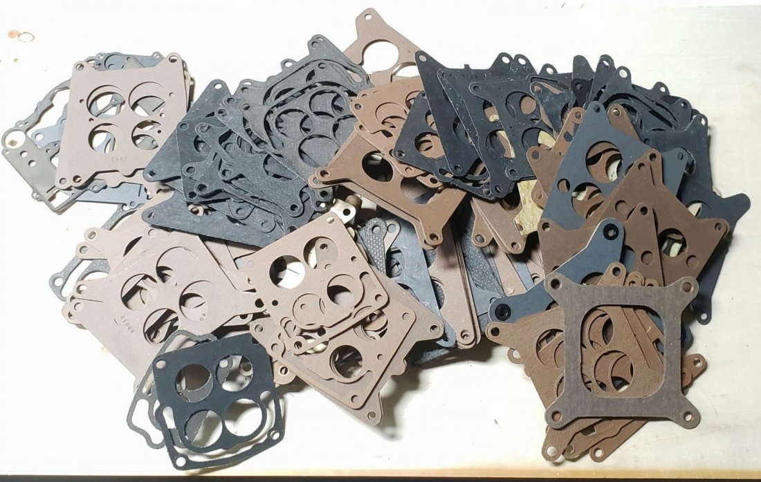 Mixed Lot of New Carburetor Base Gaskets: Lot of original vintage parts. Please read and understand the terms of this auction prior to placing bids. All bidders are bound to the terms of this auction.
