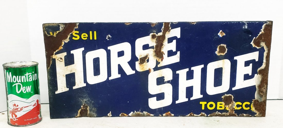 Horse Shoe Tobacco Flange Sign: 18" x 8" porcelain flange sign with scuffs, scratches, stains, and porcelain loss. PLEASE NOTE, THERE IS ONLY ONE WAY TO PAY FOR ONLINE ITEMS IN THIS AUCTION WHICH IS THROUGH LIVE AUCTIONEERS. THIS IS