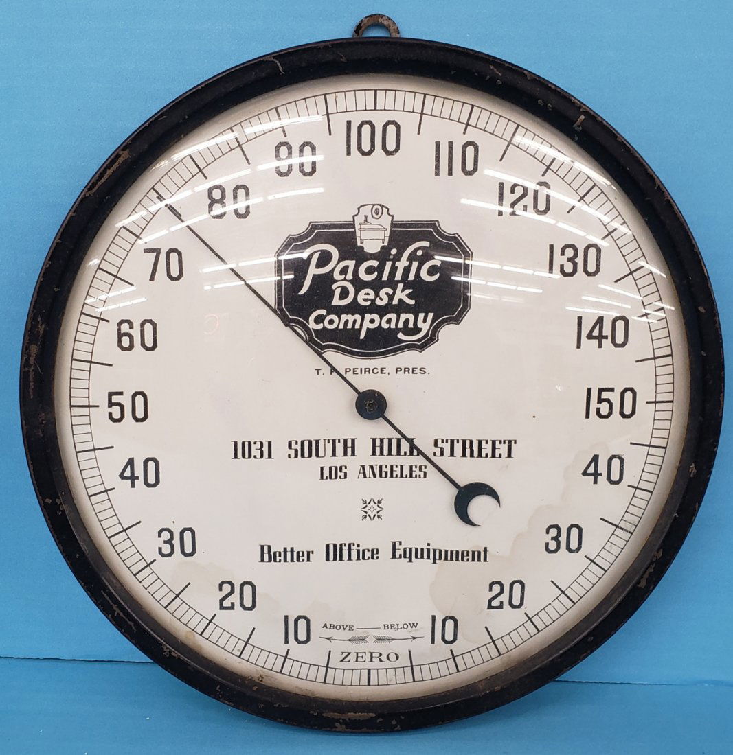 Pacific Desk Company Round Thermometer: 9" Early thermomter with glass face and light stains at the bottom. Read a few degrees high. PLEASE NOTE, THERE IS ONLY ONE WAY TO PAY FOR ONLINE ITEMS IN THIS AUCTION WHICH IS THROUGH LIVE AUCTIONEER