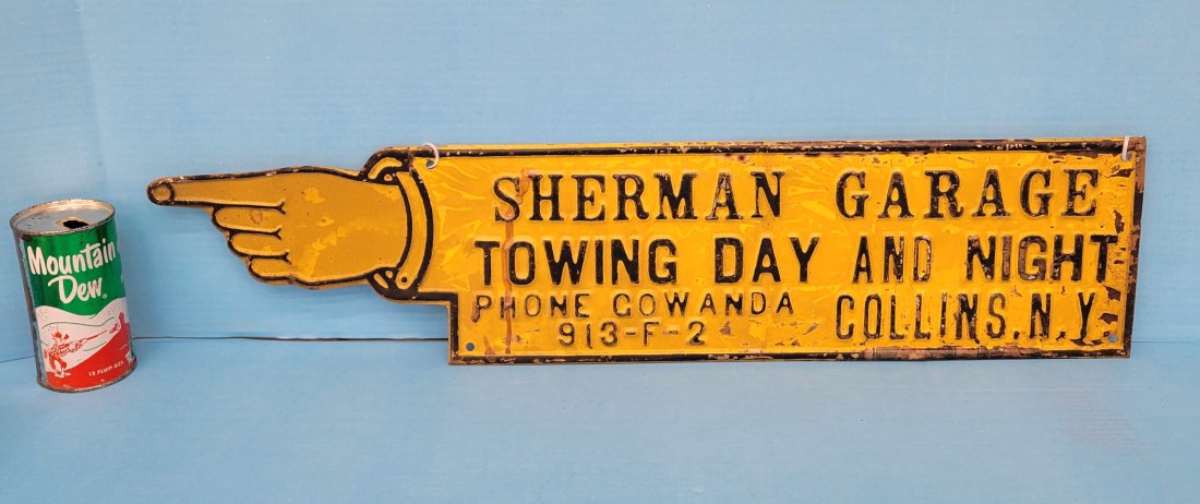 Embossed pointer directional sign Sherman Garage (1 of 3)