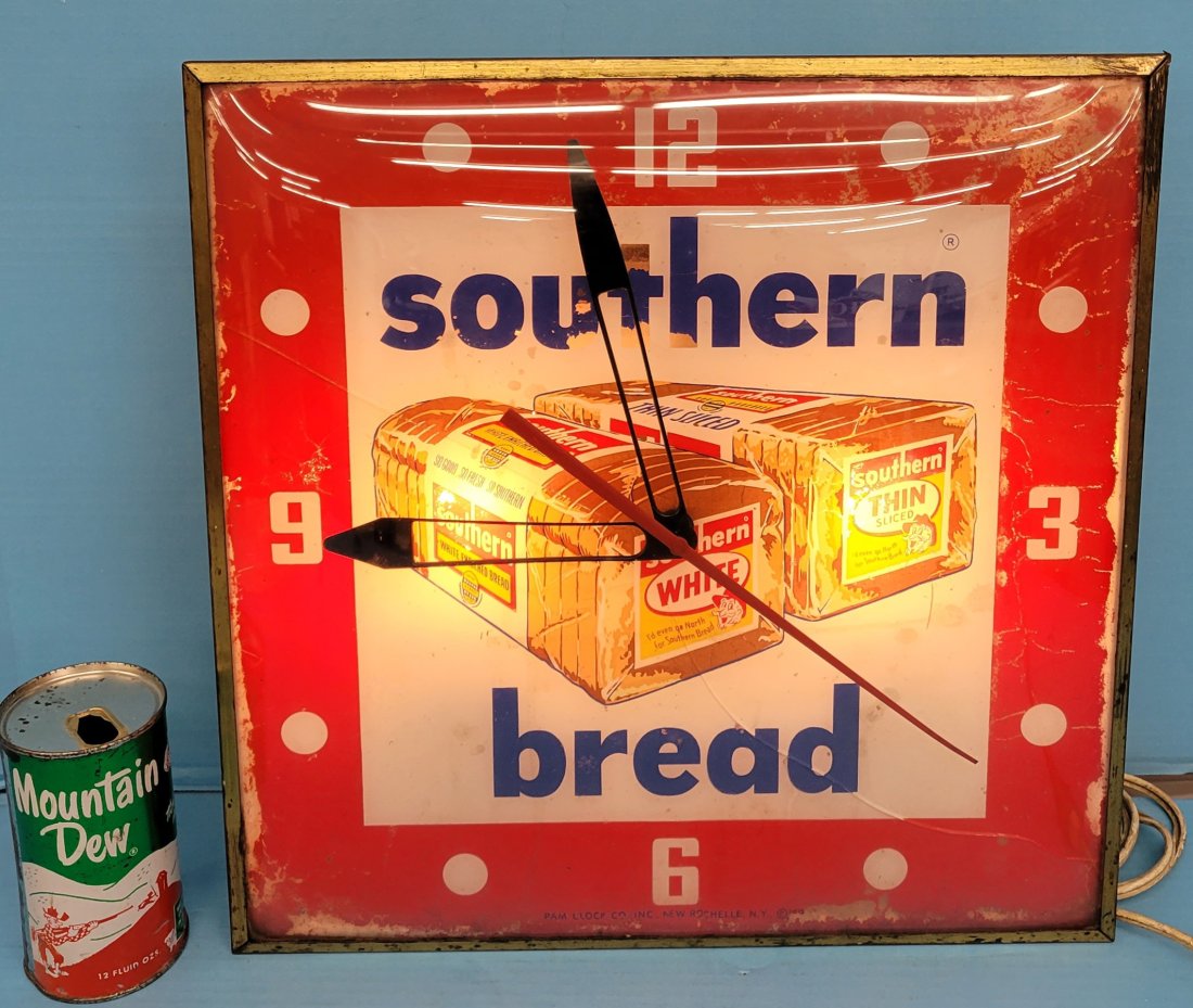 Southern Bread Pam light up clock: 15" x 15" Working Southern Bread Pam Clock with flaking paint, stains and a crack in the glass from side to side. PLEASE NOTE, THERE IS ONLY ONE WAY TO PAY FOR ONLINE ITEMS IN THIS AUCTION WHICH IS TH