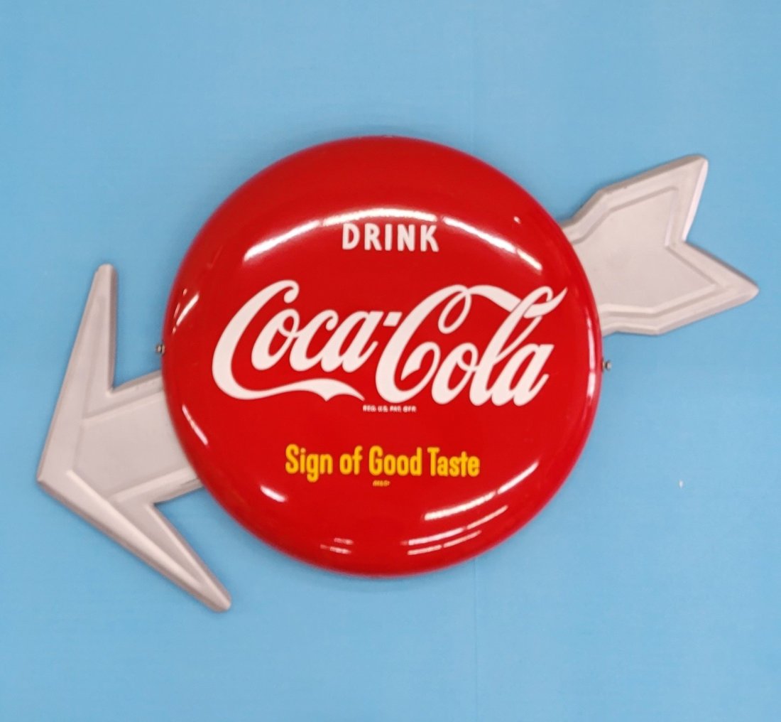 Coca Cola Button Arrow Sign.