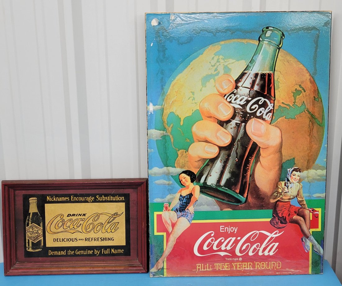 Drink Coca Cola & Enjoy Coca Cola Advertising Signs: Lot of 2 Coca Cola pieces including 24" x 36" 1997 pressboard sign Enjoy Coca Cola with a protective cover that is beginning to peel, and water stains all the way around with scuffs and scratches. 20"