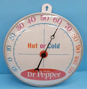 Drink Dr Pepper Hot or Cold Round Pam Thermometer: 12" Working round thermometer with bright colors, glass face, and aluminum can. There is a scratch at the bottom and light scratches in the field. Mfg. by Pam Clock Co. PLEASE NOTE, THERE IS ONLY ONE