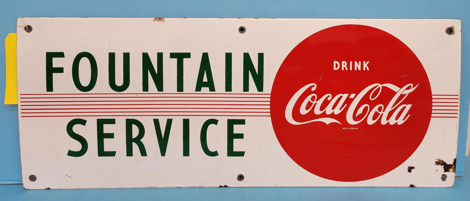 Drink Coca Cola Fountain Service Single Sided Porcelain Sign: Coke. 29.5" x 12" SSP fountain service sign with good color, light scratches in the field. Several small porcelain chips around the edges and a few chips on the right corner. PLEASE NOTE, THERE IS ONL