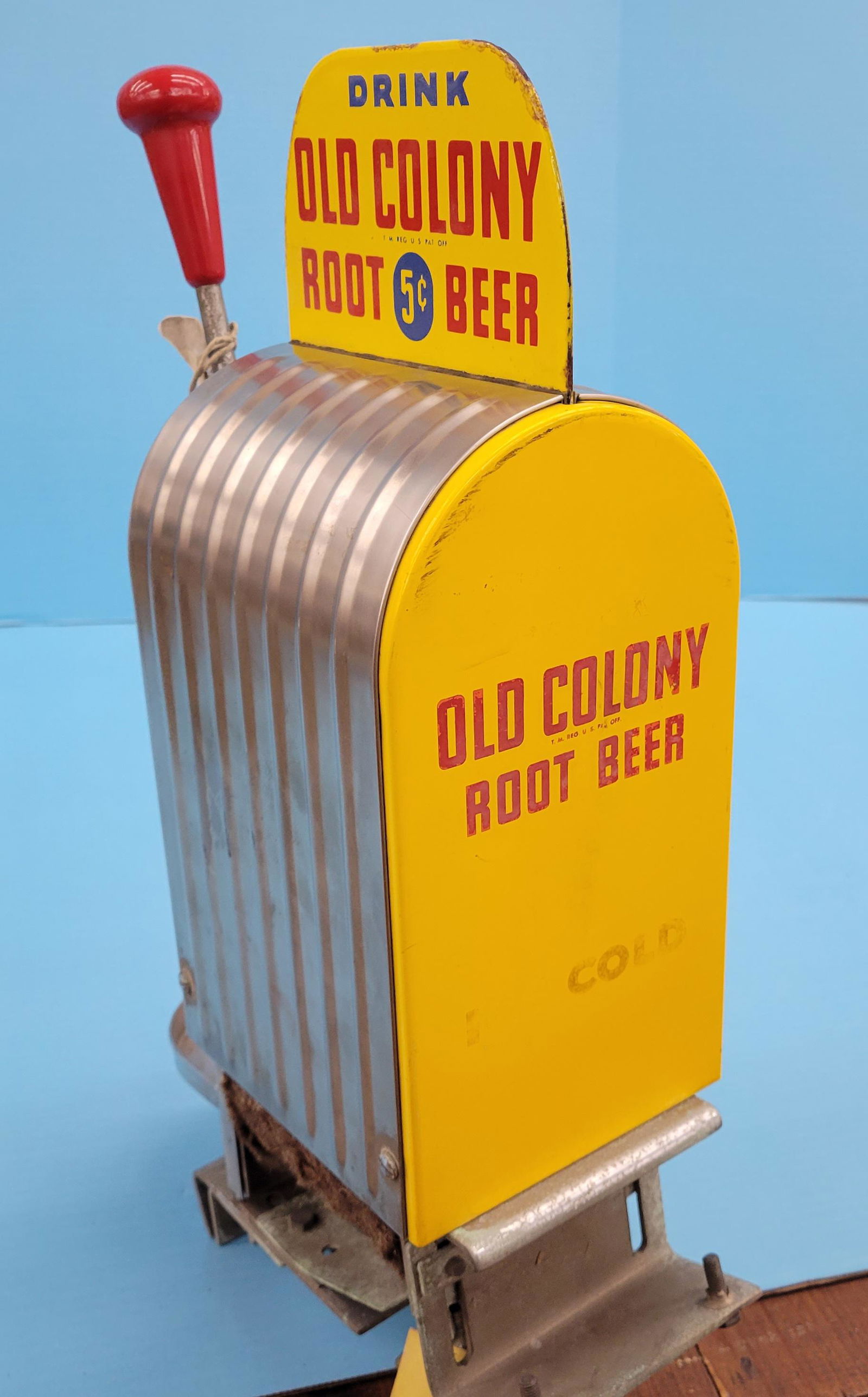 Drink Old Colony Root Beer Soda Fountain Dispenser w/ porcelain sign: 11" x 5.5" x 18"h Old Colony Root Beer counter mount dispenser with a double sided porcelain sign on top, logo on the back, and stainless steel body. The porcelain sign shows good color with minor edg