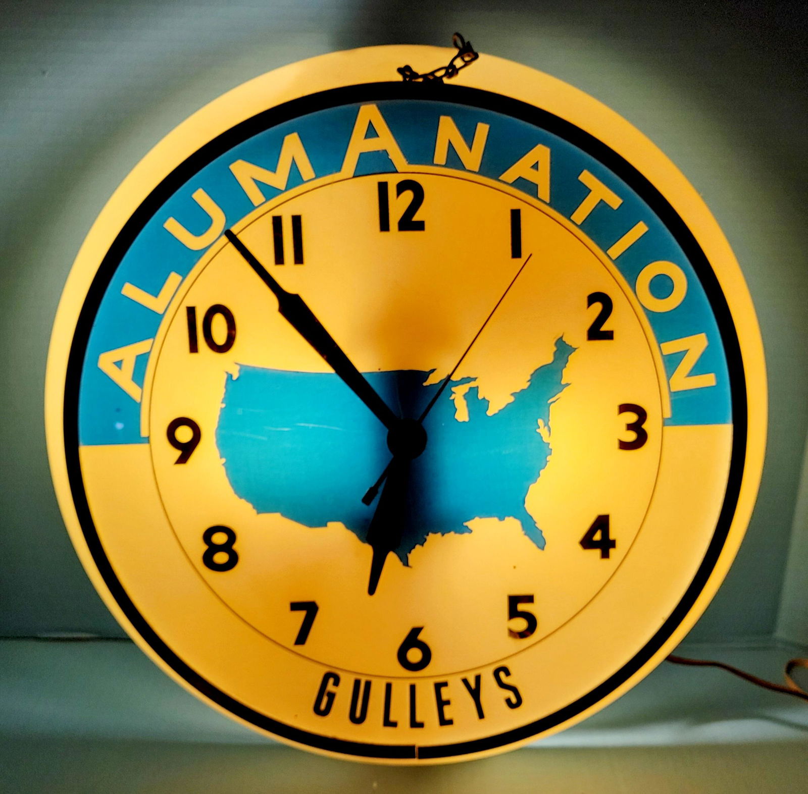 Gulleys Alumanation Dualite Electric Light Up Clock: 16" working Dualite clock with good color. The outer plastic outside the aluminum trim shows some fading and scuffs. PLEASE NOTE, THERE IS ONLY ONE WAY TO PAY FOR ONLINE ITEMS IN THIS AUCTION WHICH IS