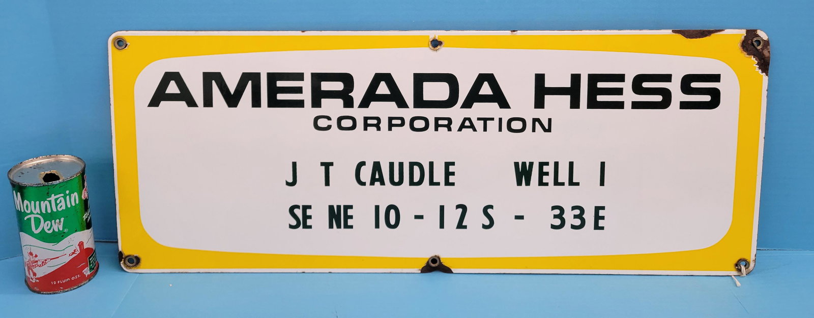 Amerada Hess Corporation Porcelain Sign: 26" x 10" Single sided porcelain sign with bright colors, high gloss, and some porcelain loss at the grommets and top edge. PLEASE NOTE, THERE IS ONLY ONE WAY TO PAY FOR ONLINE ITEMS IN THIS AUCTION W