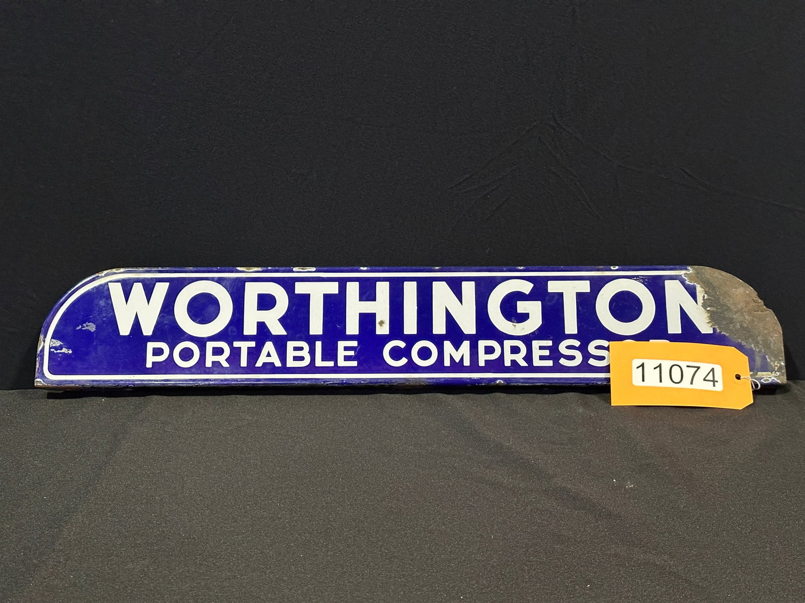 Worthington Portable Compressor flange porcelain sign: DSP (double sided porcelain) Worthington Portable compressor double sided porcelain flange sign. 4.375" H x 26" W.