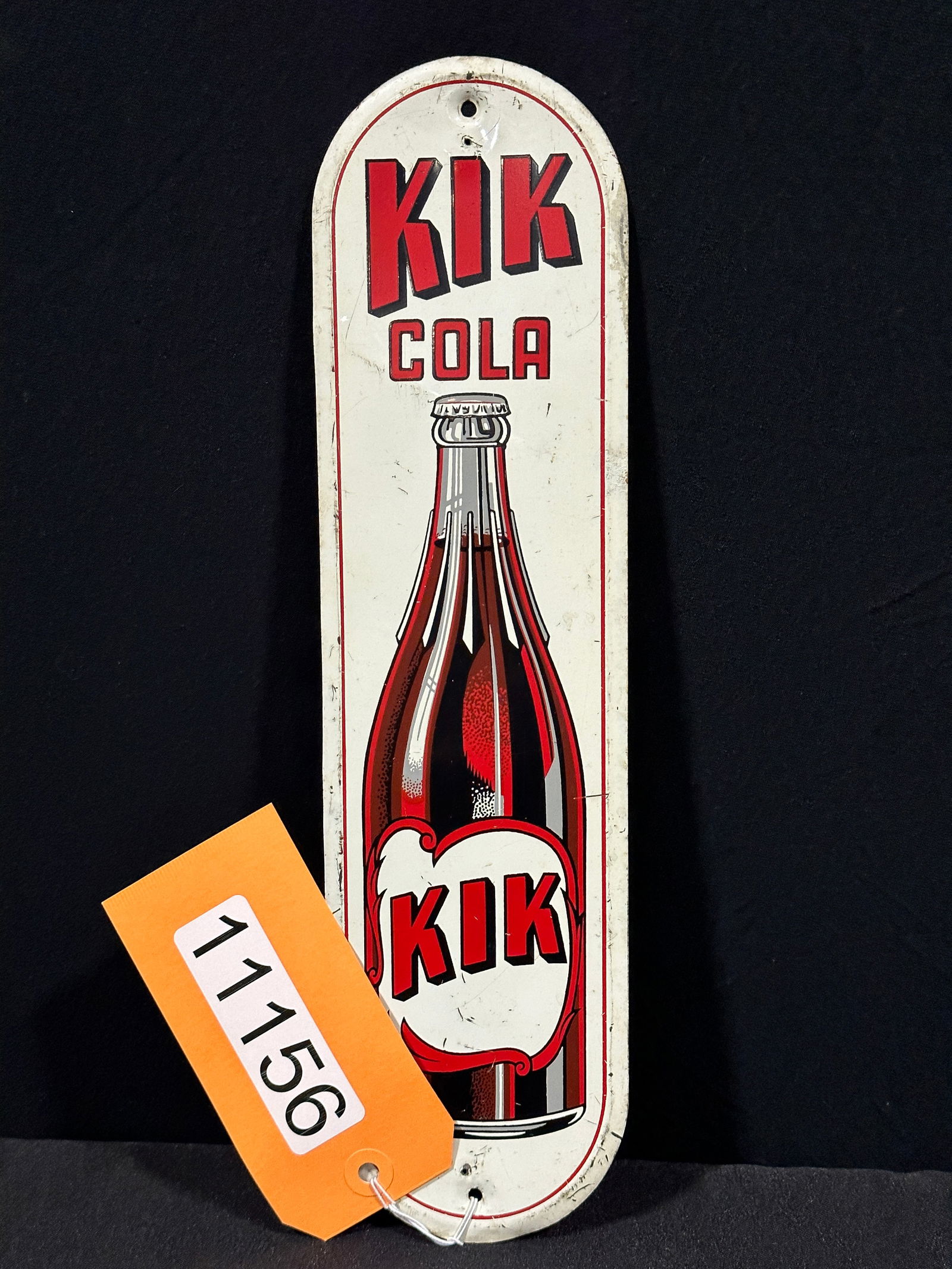 Kik cola soda bottle tin metal door push sign: SST (single sided tin) Kik cola soda bottle tin metal door push sign. 13.5" H x 3.75" W.