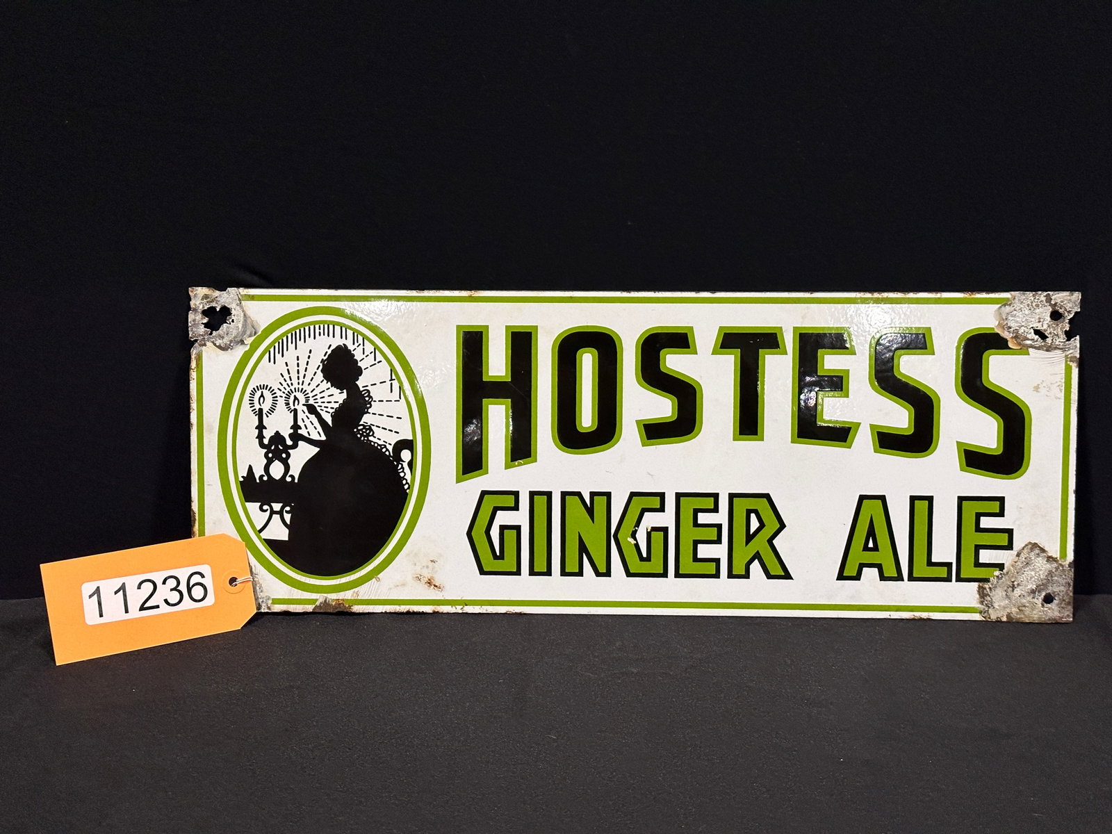 Hostess ginger ale porcelain soda sign: SSP (single sided porcelain) Hostess ginger ale porcelain soda sign. 8" H x 21.5" W.
