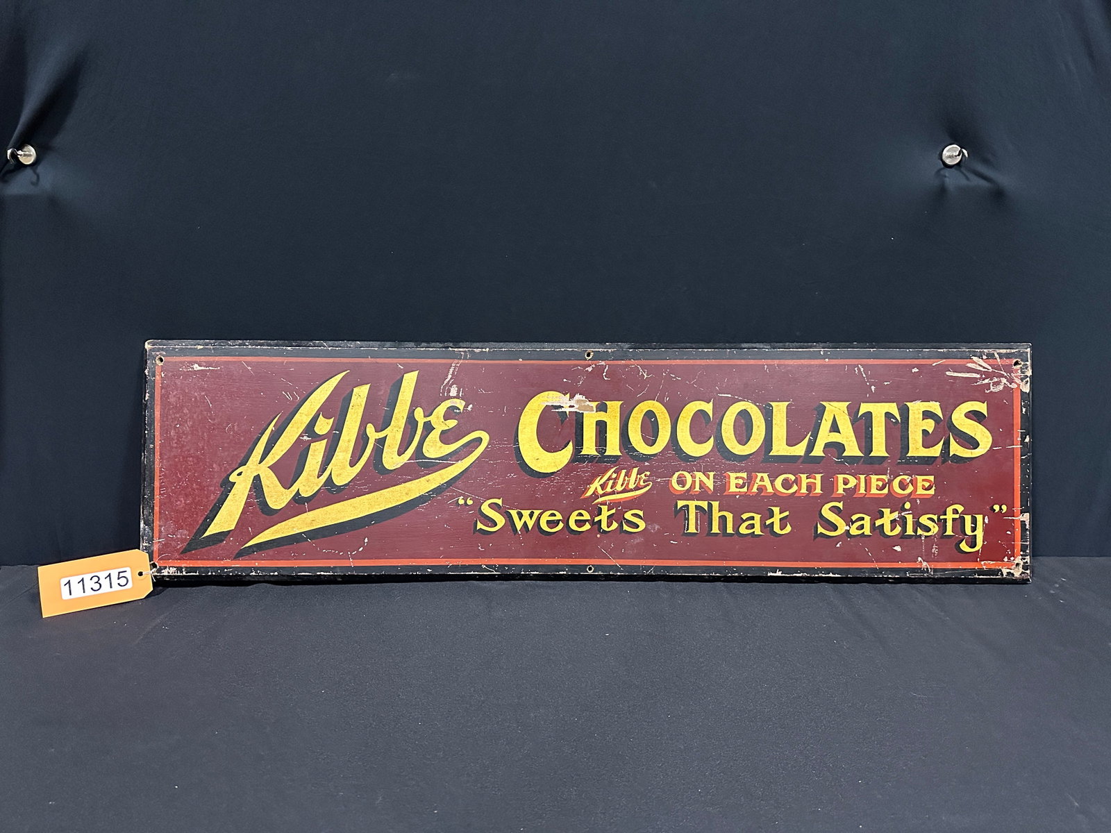 Kibbe Chocolate candy sweets painted wood sign: Kibbe chocolate sweets that satisfy painted wood sign. 12" H x 44" W x 1" D.