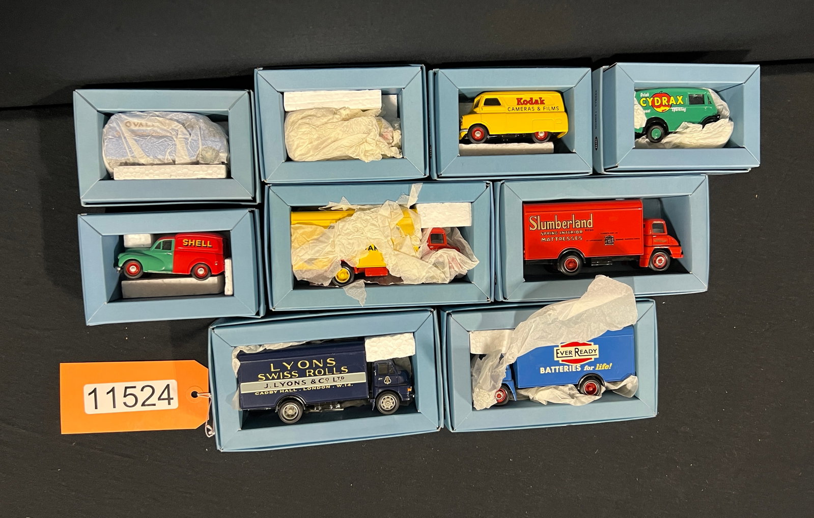 Corgi Gold Oldies Shell Kodak Nestles Heinz truck: 9 Corgi trucks. Ovaltine, Slumberland, Heinz, Lyons, ever ready, shell, cydrax, Kodak and Nestles. 7" H x 7" W x 4" D.