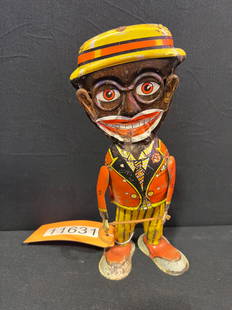 Marx tin litho walker Amos Andy Mamma Boy wind up toy: Mamma boy tin litho wind up toy. Functions when wound, but doesn?t move under standing pressure. 11" H x 4" W x 3" D.