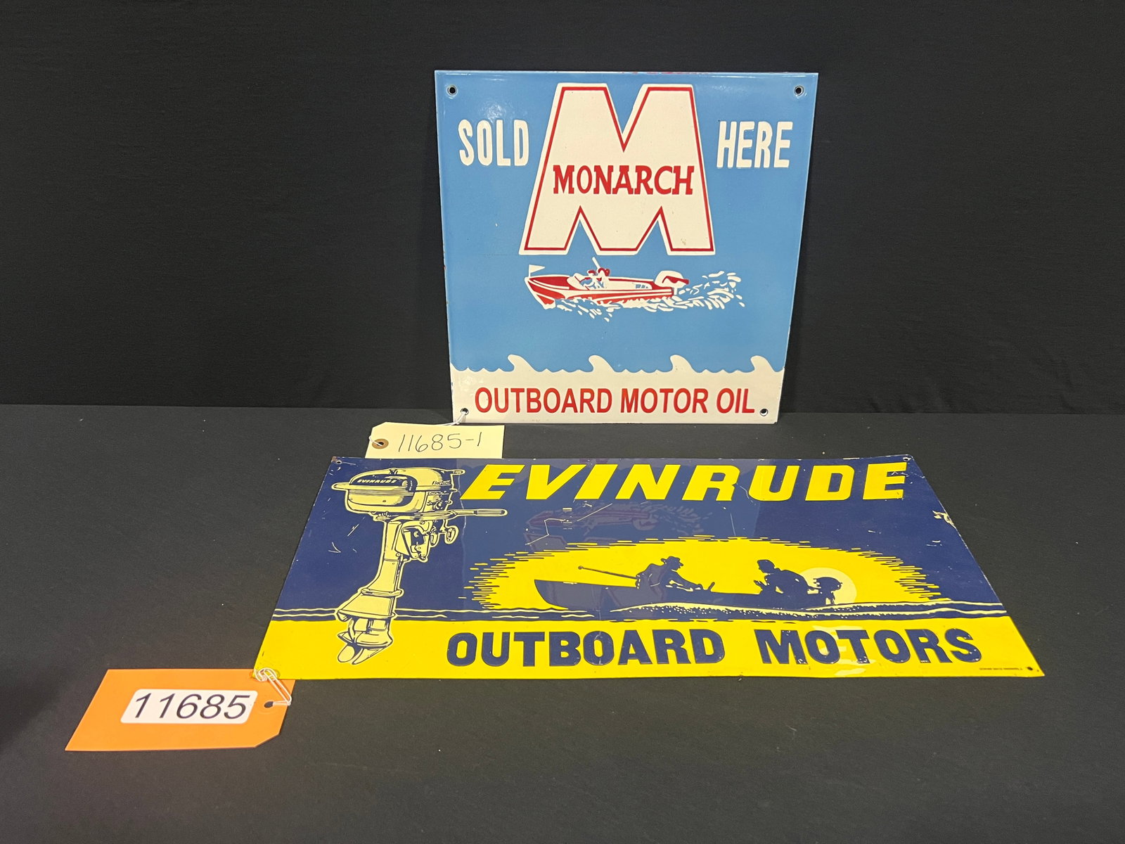 Evinrude Monarch outboard motor reproduction signs: Evinrude Outboard Motors tin and Monarch Outboard motor oil porcelain reproduction signs. 20" H x 9.75" W.