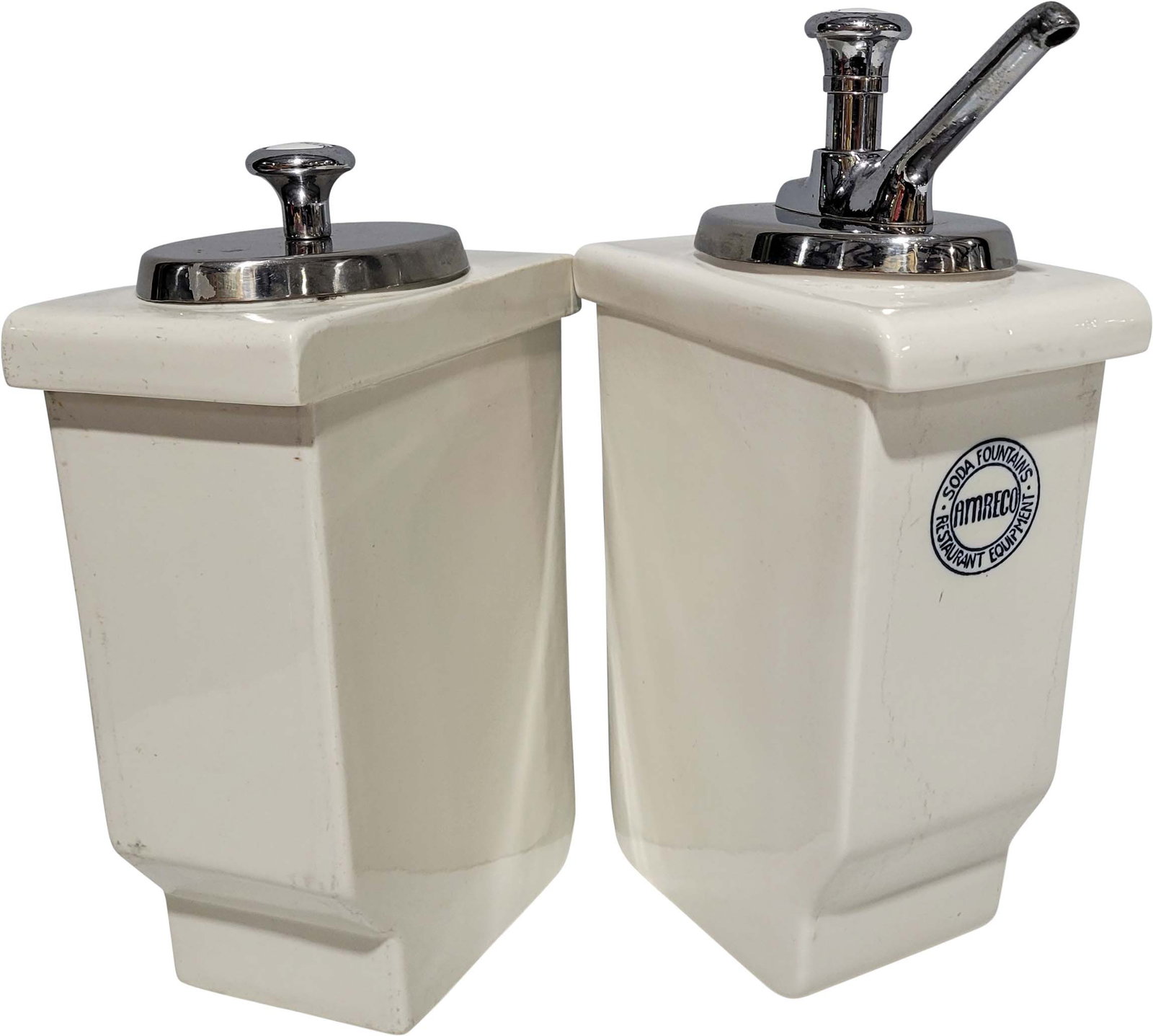 Porcelain Soda Fountain Canisters: Lot of 2 porcelain Amreco soda fountain canisters. One is labeled Coca Cola and has a pump included. The other is labeled Root Beer and has a scoop attached to the underside of the lid. 4.5" x 8" x 14