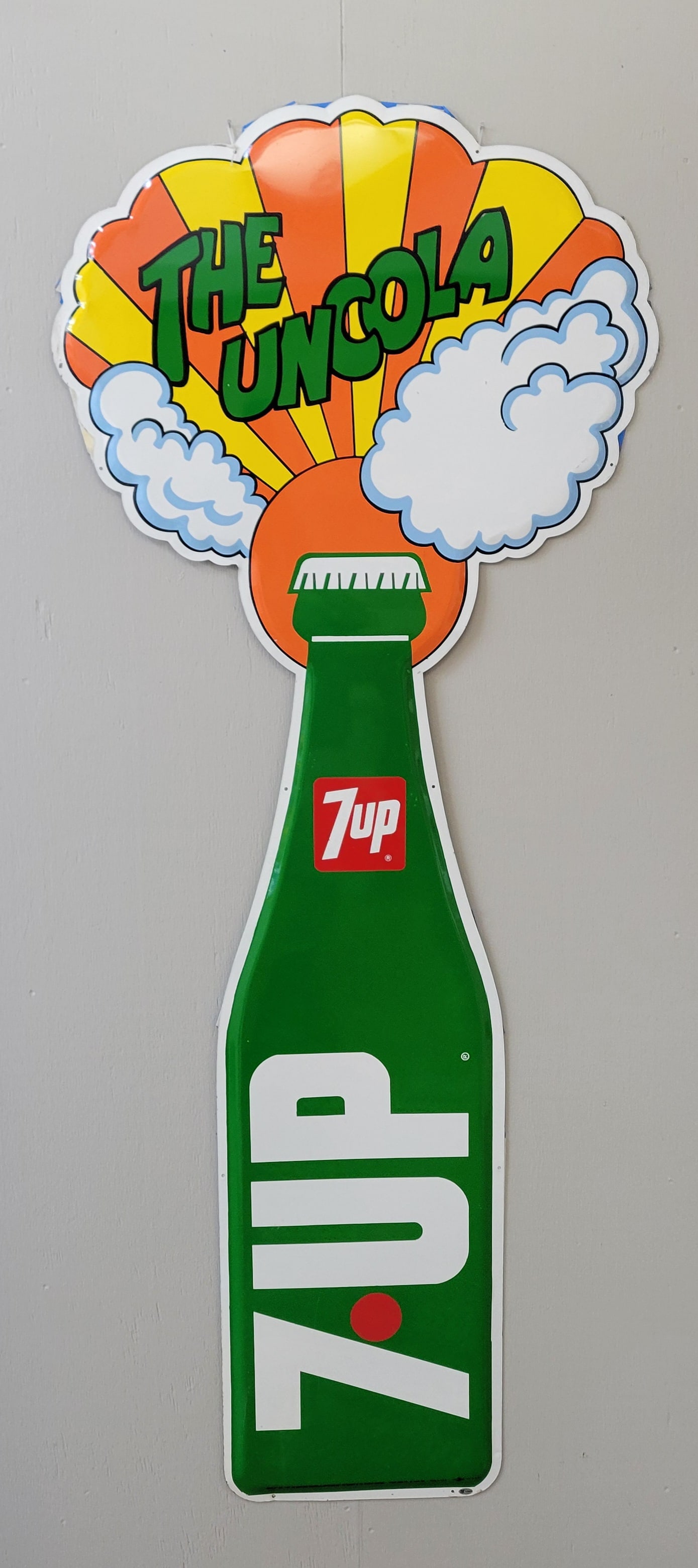 7up The Uncola Die Cut Bottle Sign Large TAC: 29" x 71" SST die cut sign in excellent condition with bright colors and high shine. There are only a few minor scuffs in the cloud on the right and in the green on the bottle. Great looking sign in n