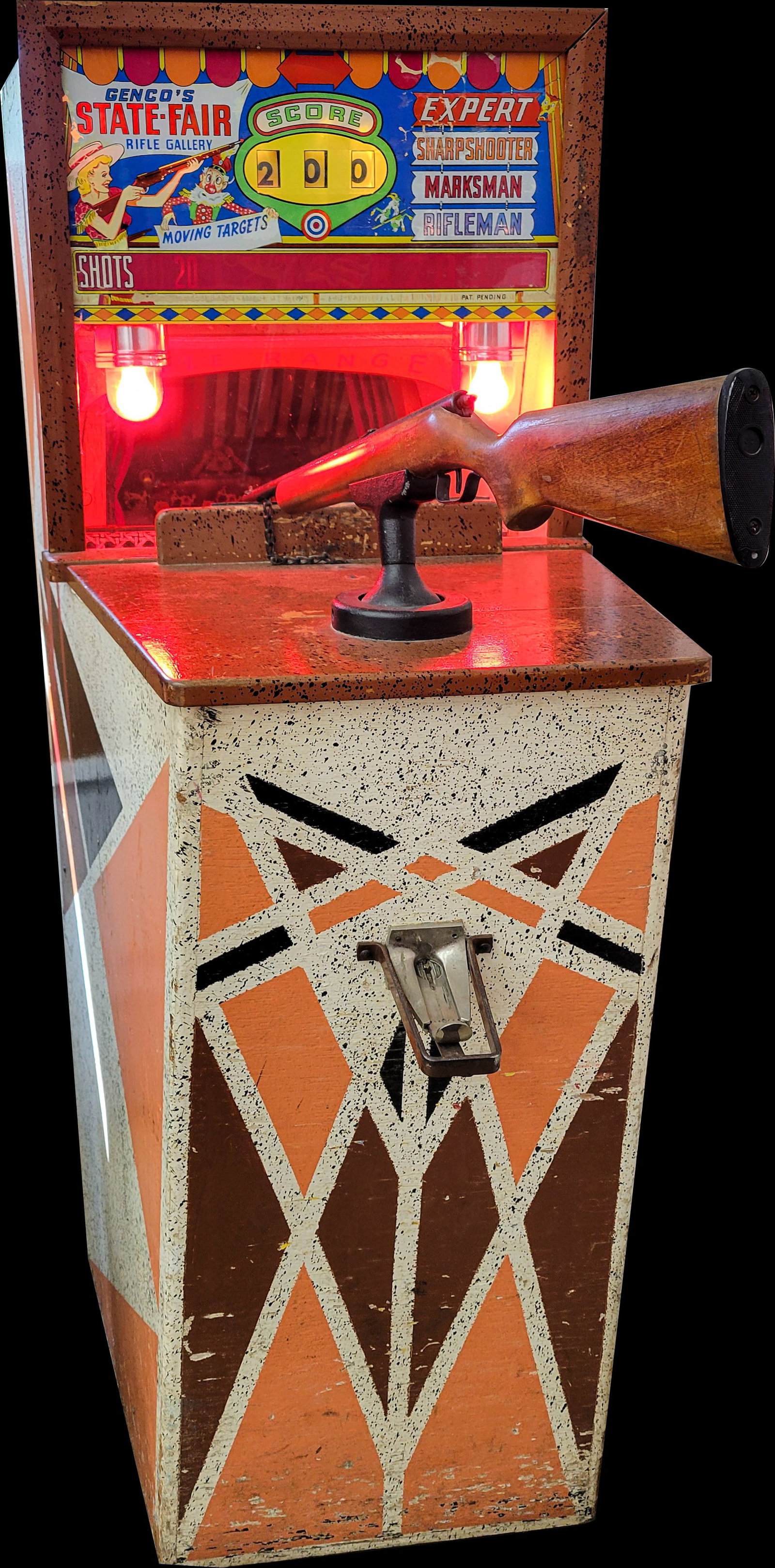Genco's State Fair Rifle Gallery Coin Op Shooting Game: 26"w x 42"d x 71.5"h 25 cent coin op shooting game that appears to be in proper working order. The game lights up and targets knock down when shot while keeping score. There is light flaking on the ba