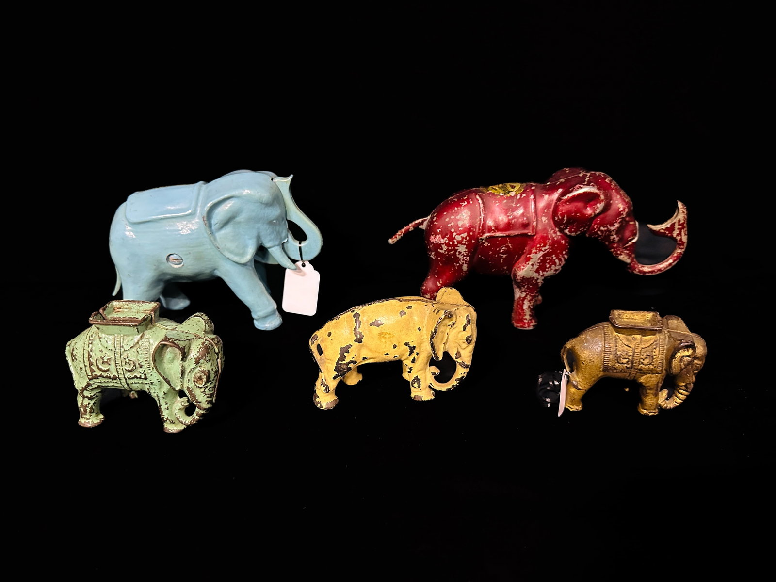 5 Antique elephant cast iron piggy banks. 2 Mechanical: 2 Mechanical banks that semi work and 3 cast iron elephant banks. PLEASE NOTE, THERE IS ONLY ONE WAY TO PAY FOR ONLINE ITEMS IN THIS AUCTION WHICH IS THROUGH LIVE AUCTIONEERS. THIS IS THE MOST SECURE 