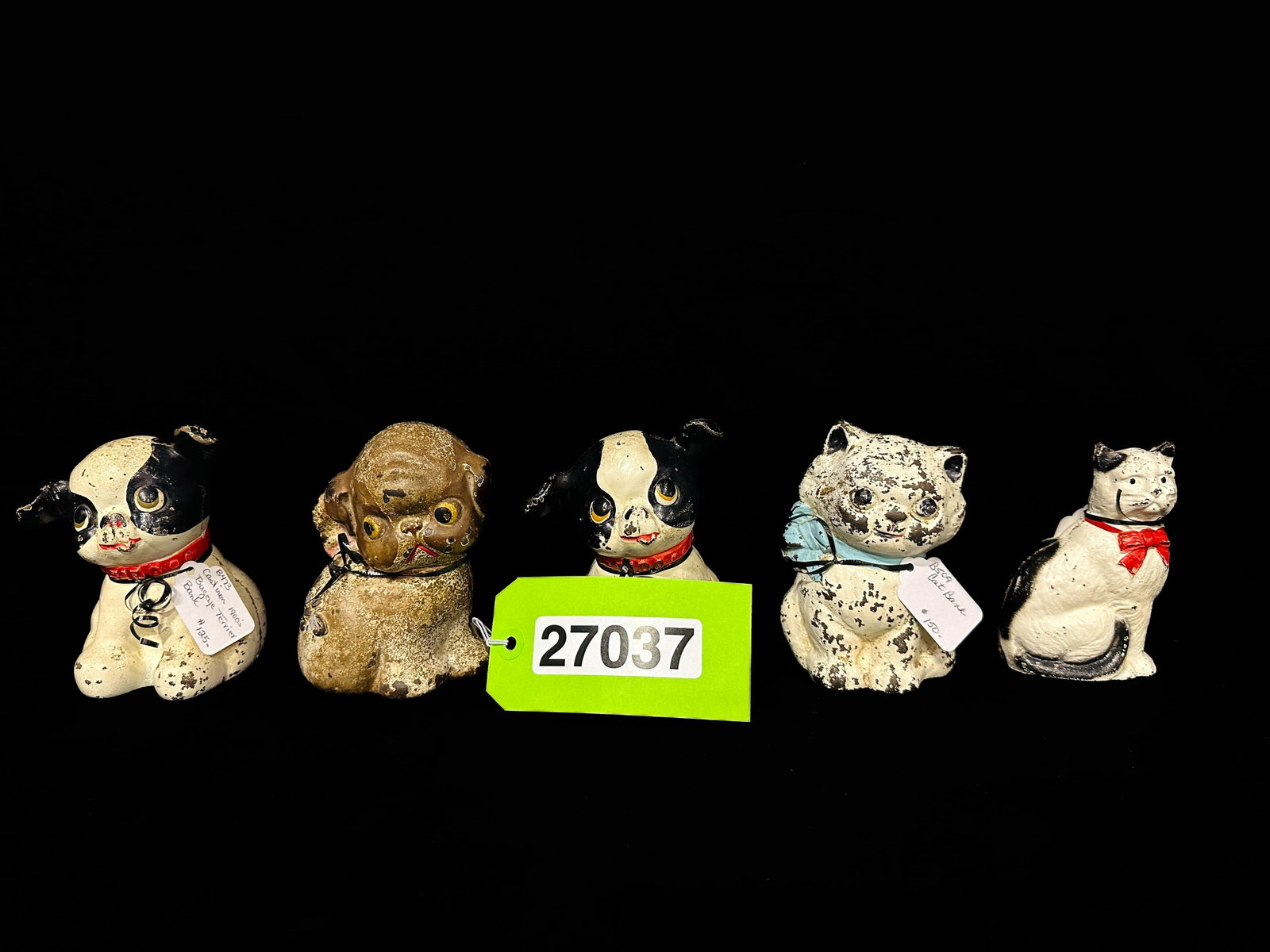 Cat and Dog cast iron piggy bank: 3 Dogs and 2 cat cast iron piggy banks. PLEASE NOTE, THERE IS ONLY ONE WAY TO PAY FOR ONLINE ITEMS IN THIS AUCTION WHICH IS THROUGH LIVE AUCTIONEERS. THIS IS THE MOST SECURE METHOD OF PAYMENT. MAKE SU