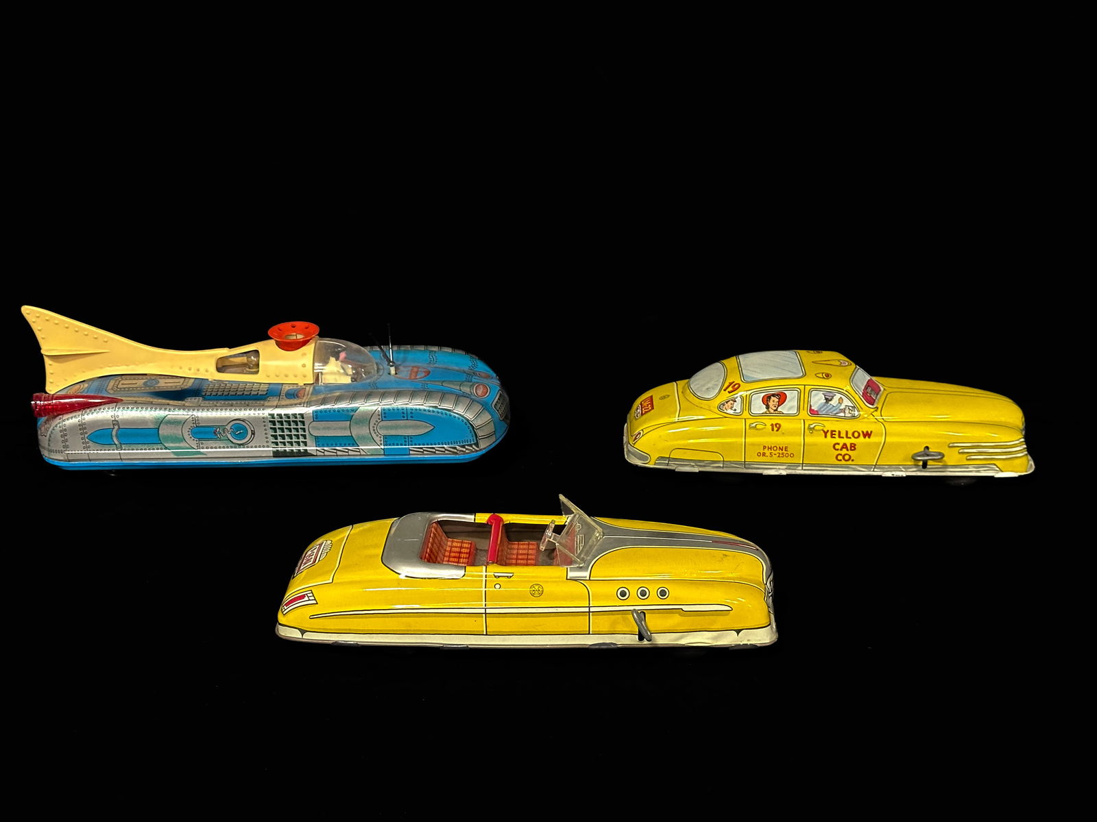 Marx yellow cab wind up Roadster tin yellow toy Hungarian spaceship toy (1 of 2)