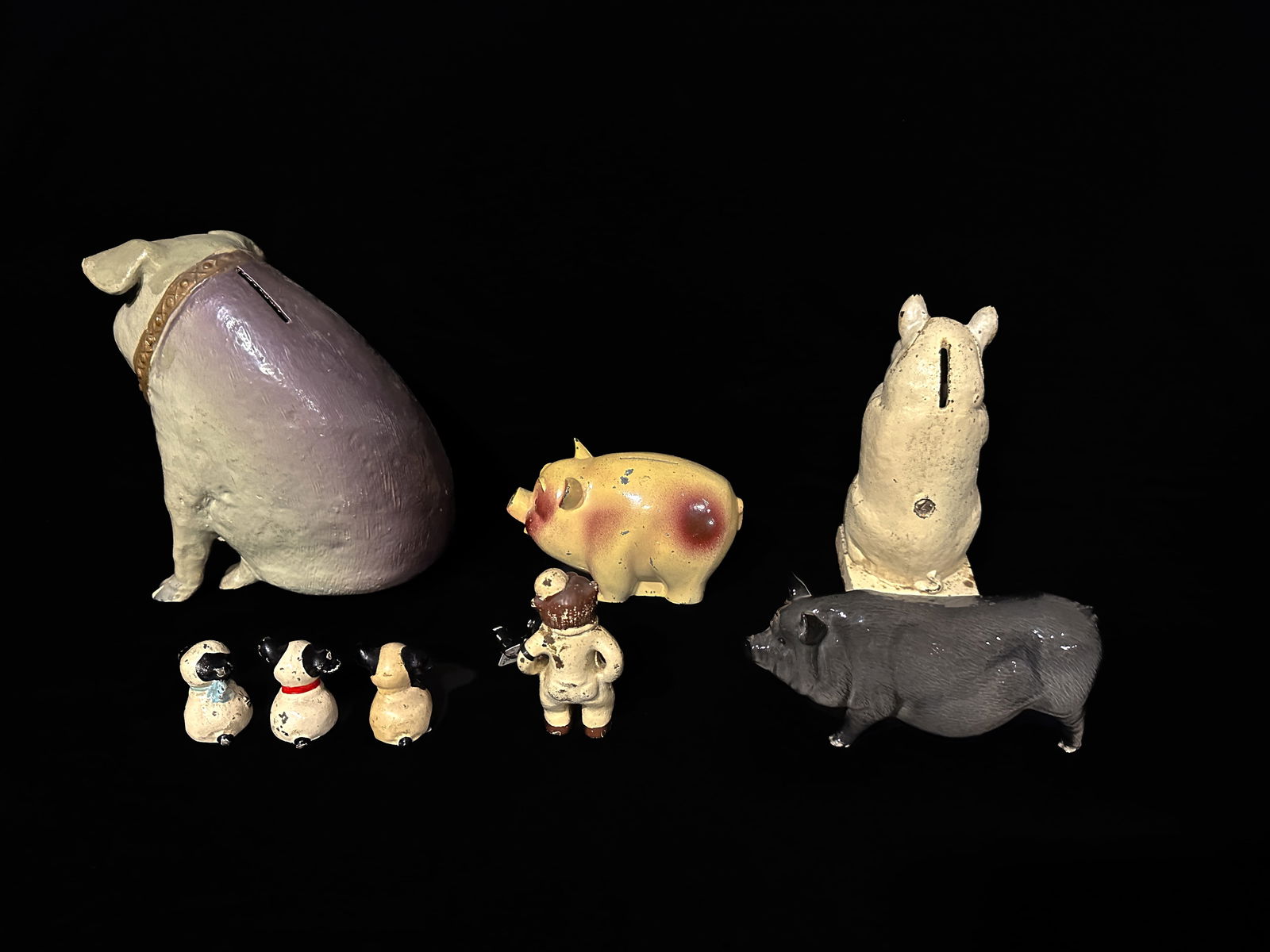 3 Pig banks 1 Royal Doulton Pig 3 cast painted dogs Parker Vises Cast iron bear paperweight (1 of 2)