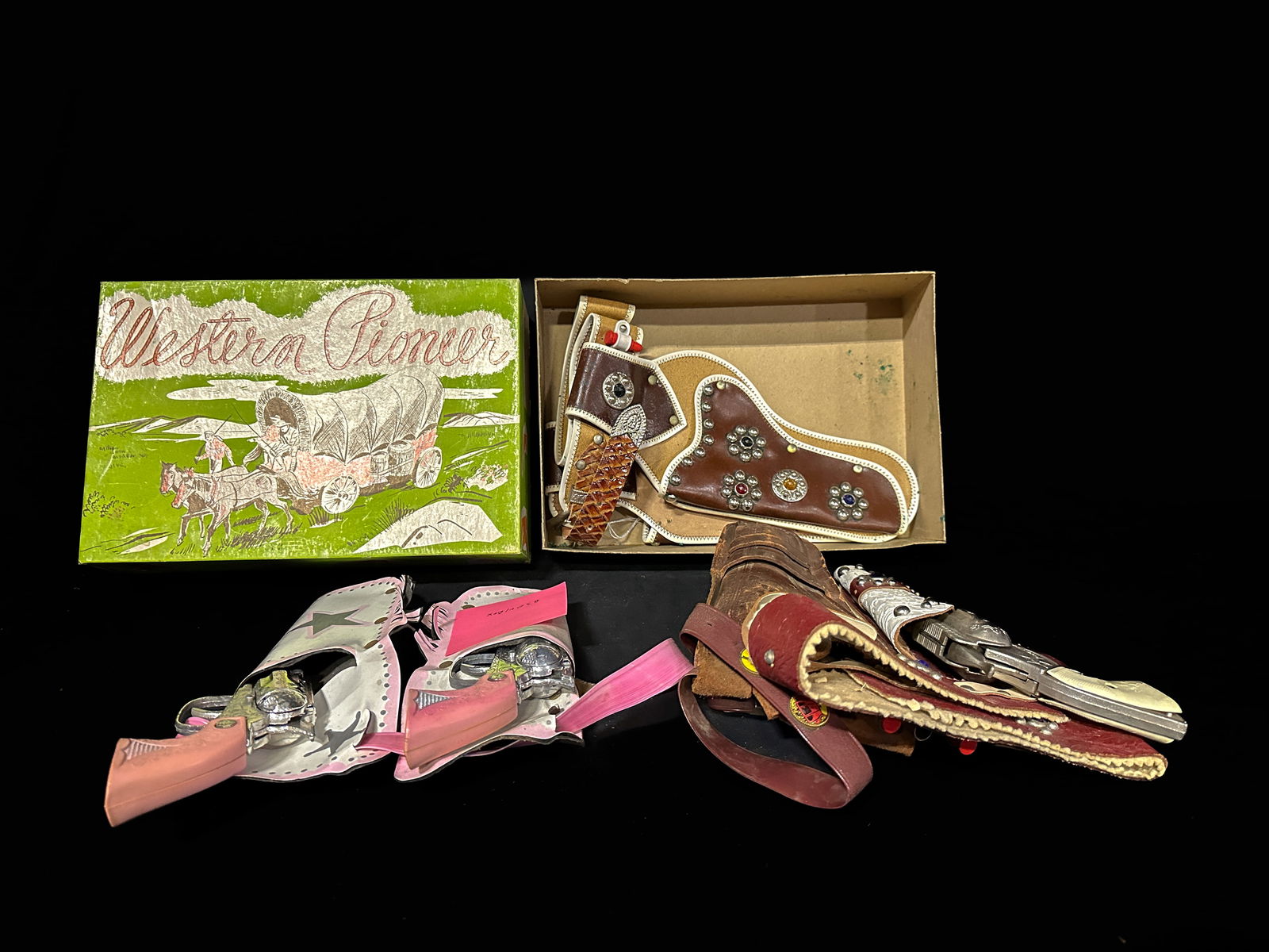 Western Pioneer cap guns with holster. Texas Ranger cap gun with holster: Texas ranger and western pioneer cap guns with holster. PLEASE NOTE, THERE IS ONLY ONE WAY TO PAY FOR ONLINE ITEMS IN THIS AUCTION WHICH IS THROUGH LIVE AUCTIONEERS. THIS IS THE MOST SECURE METHOD OF