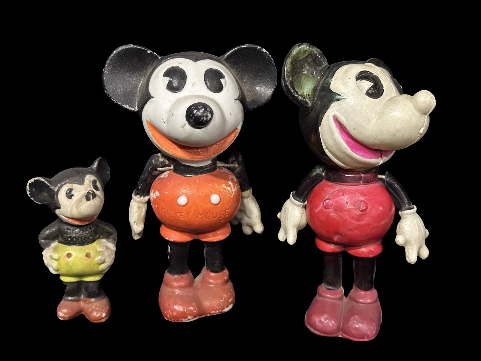 Disney Mickey Mouse old toys. Arms attached by strings 1930?s: Red belly mickey is made of plastic, the orange belly one is cast. Both have arms attached by strings, both with paper on bottom stating 1928-1930 Disney. PLEASE NOTE, THERE IS ONLY ONE WAY TO PAY FOR