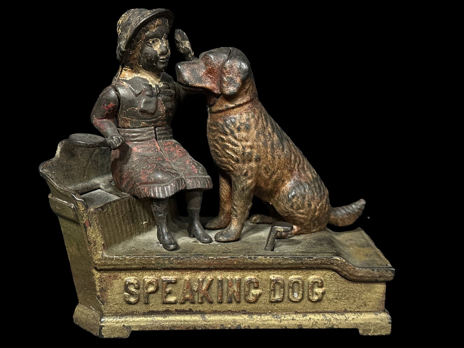 Speaking dog cast iron mechanical coin bank: Press button and she turns her hand to drop the coin as the dog mouth opens. Functioning. PLEASE NOTE, THERE IS ONLY ONE WAY TO PAY FOR ONLINE ITEMS IN THIS AUCTION WHICH IS THROUGH LIVE AUCTIONEERS. 