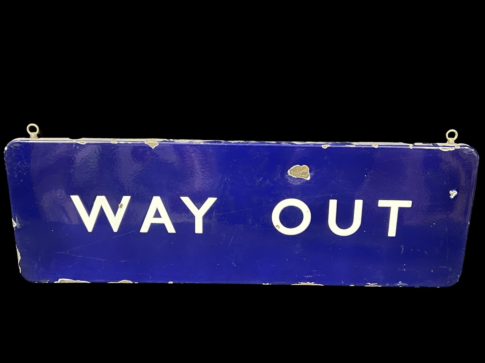 Way out porcelain sign: Multiple chips in the field and edge, still displays well. Has hooks on the top for hanging. PLEASE NOTE, THERE IS ONLY ONE WAY TO PAY FOR ONLINE ITEMS IN THIS AUCTION WHICH IS THROUGH LIVE AUCTIONEER