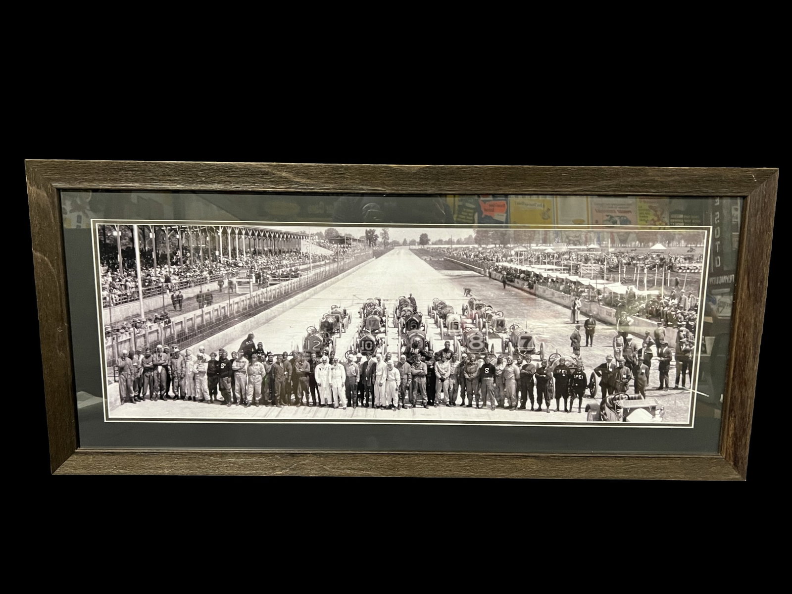 Reproduction 1912 Indy 500 photo. Rickenbacker Depalma Dawson Merz Mulford Disbrow and others: Framed reproduction photo from 1912 Indy 500. PLEASE NOTE, THERE IS ONLY ONE WAY TO PAY FOR ONLINE ITEMS IN THIS AUCTION WHICH IS THROUGH LIVE AUCTIONEERS. THIS IS THE MOST SECURE METHOD OF PAYMENT. M