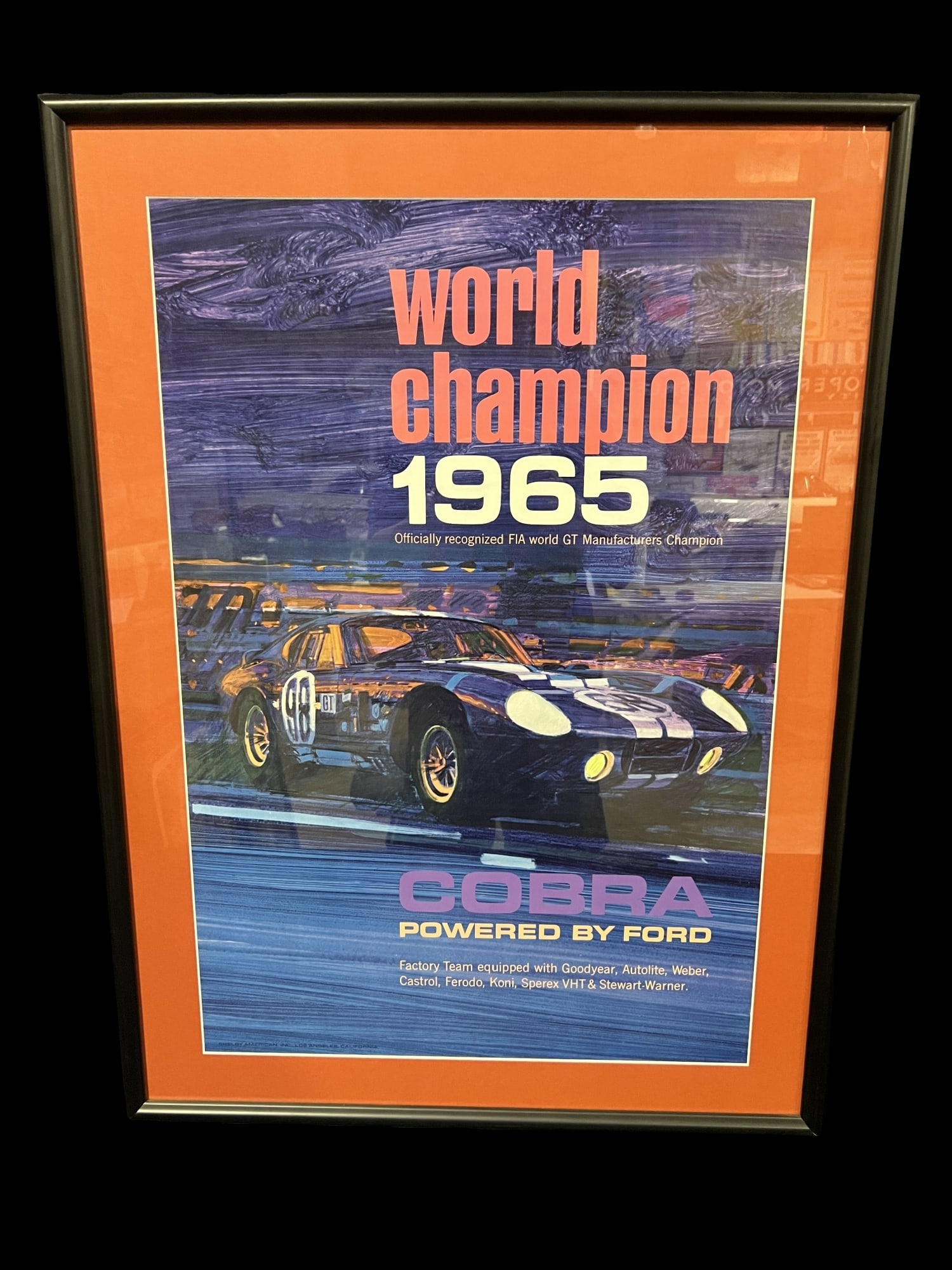 1965 World Champion Ford Cobra FIA GT manufactures champion poster display: Framed Ford Cobra poster. PLEASE NOTE, THERE IS ONLY ONE WAY TO PAY FOR ONLINE ITEMS IN THIS AUCTION WHICH IS THROUGH LIVE AUCTIONEERS. THIS IS THE MOST SECURE METHOD OF PAYMENT. MAKE SURE YOUR LIVE A
