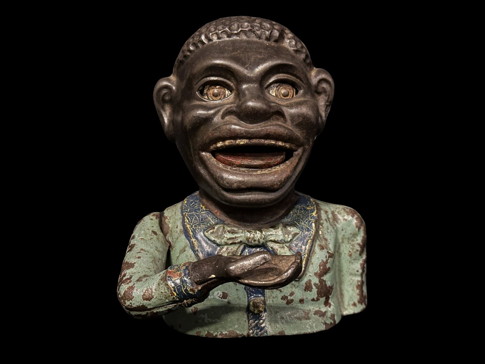 English Jolly Black Americana Mechanical Bank: English Jolly bank in working condition. PLEASE NOTE, THERE IS ONLY ONE WAY TO PAY FOR ONLINE ITEMS IN THIS AUCTION WHICH IS THROUGH LIVE AUCTIONEERS. THIS IS THE MOST SECURE METHOD OF PAYMENT. MAKE S