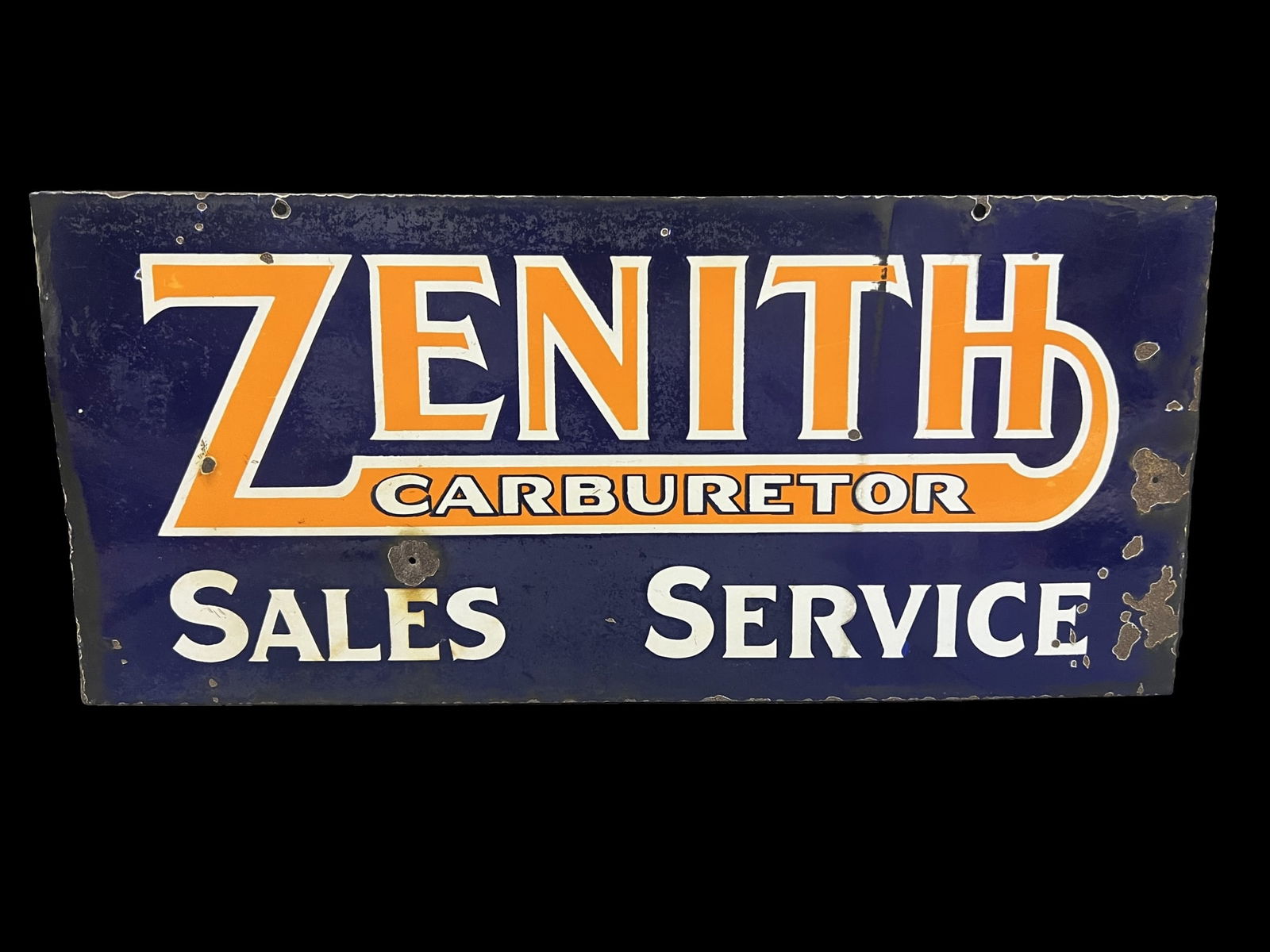 Zenith Carburetor Sales Service porcelain sign: Bullet hole and wear present throughout . 29" H x 13" W.