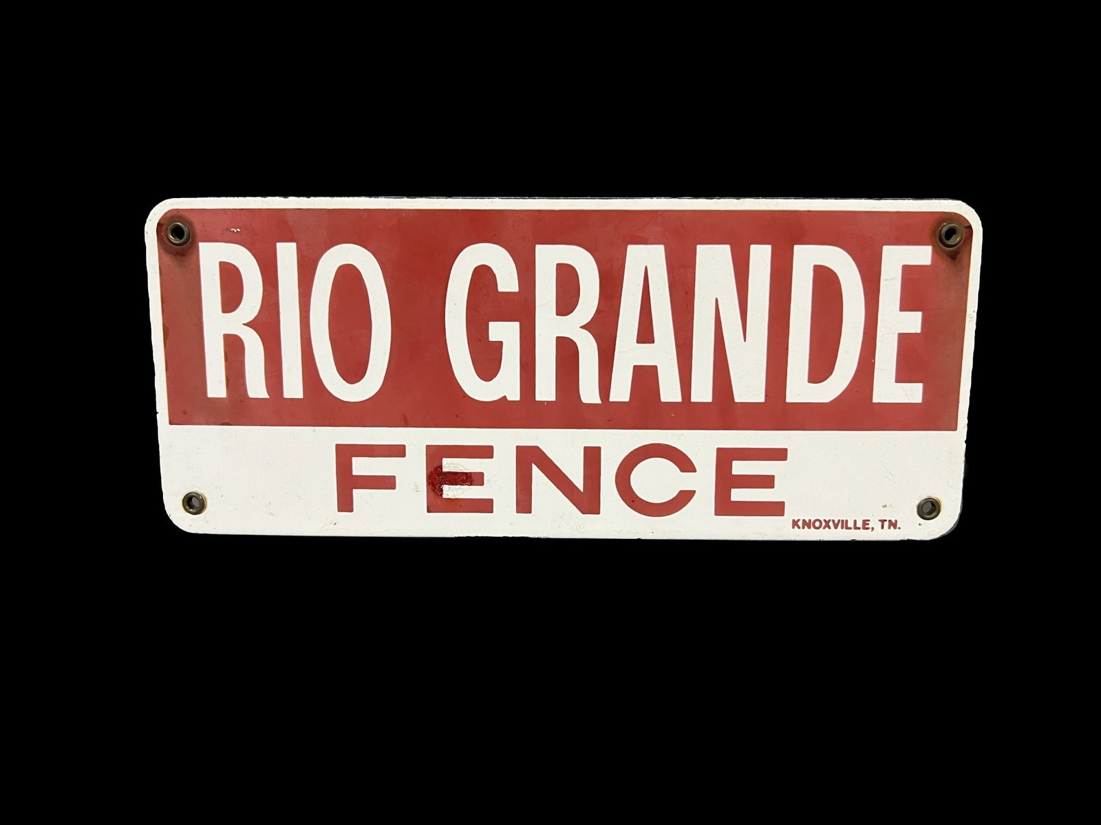 Rio Grande Fence porcelain sign: Fading present. 12" H x 5" W.
