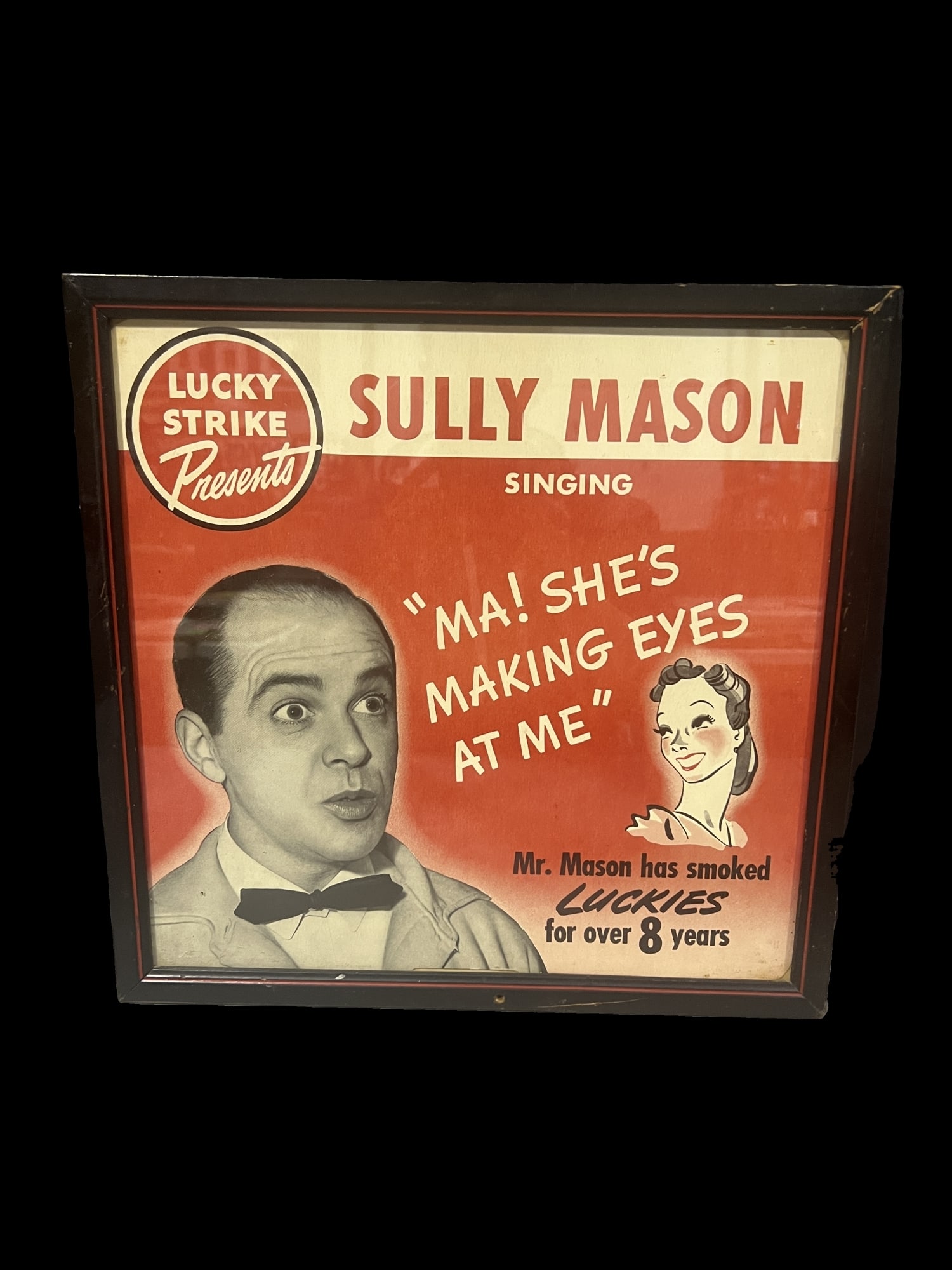 Lucky Strike Sully Mason cardboard sign: Great graphics. We can't always confirm if framed items are paper or cardboard without removing them. Consigner will not allow that. We make our best guess as to the material enclosed. 15" H x 15" W.