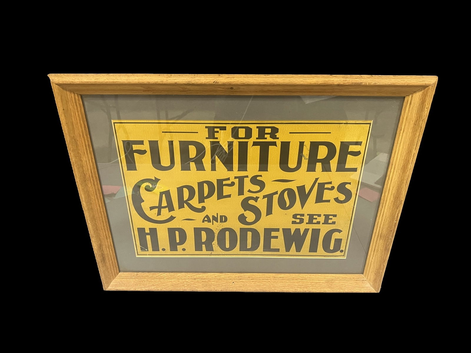 Furniture carpets stoves Rodewig sign: Great graphics. Faded. We cannot always confirm if framed items are paper or cardboard without removing them. Consigner will not allow that. We make our best guess as to the material enclosed. 27" H x