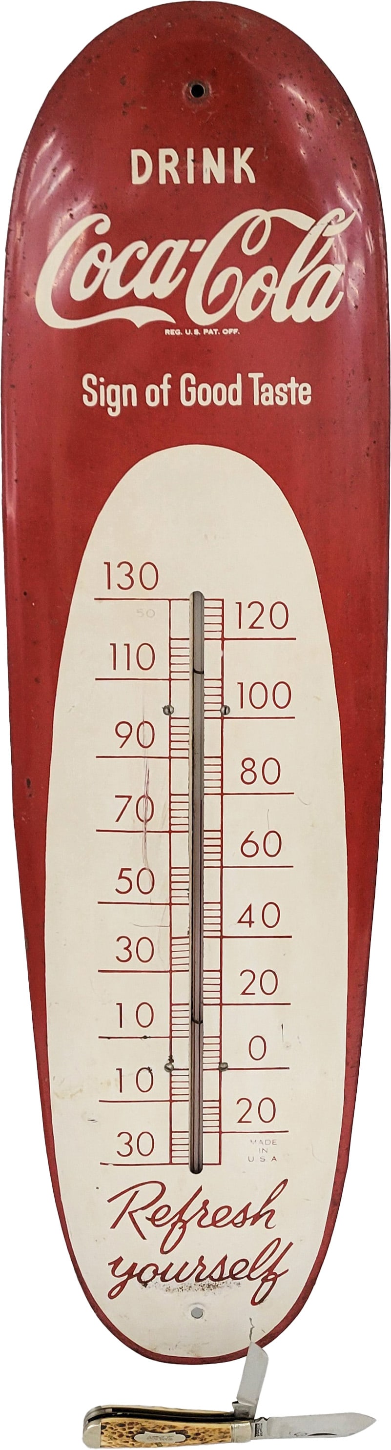 Drink Coca Cola Cigar Thermometer and 1950's Coca Cola Kutmaster Bone Pattern Pocket Knife: 30" x 8", Working tin Drink Coca Cola thermometer with scratches, stains, and a very shallow dent below the word "Sign". The Coca Cola Kutmaster pocket knife is in very good condition and appears to b