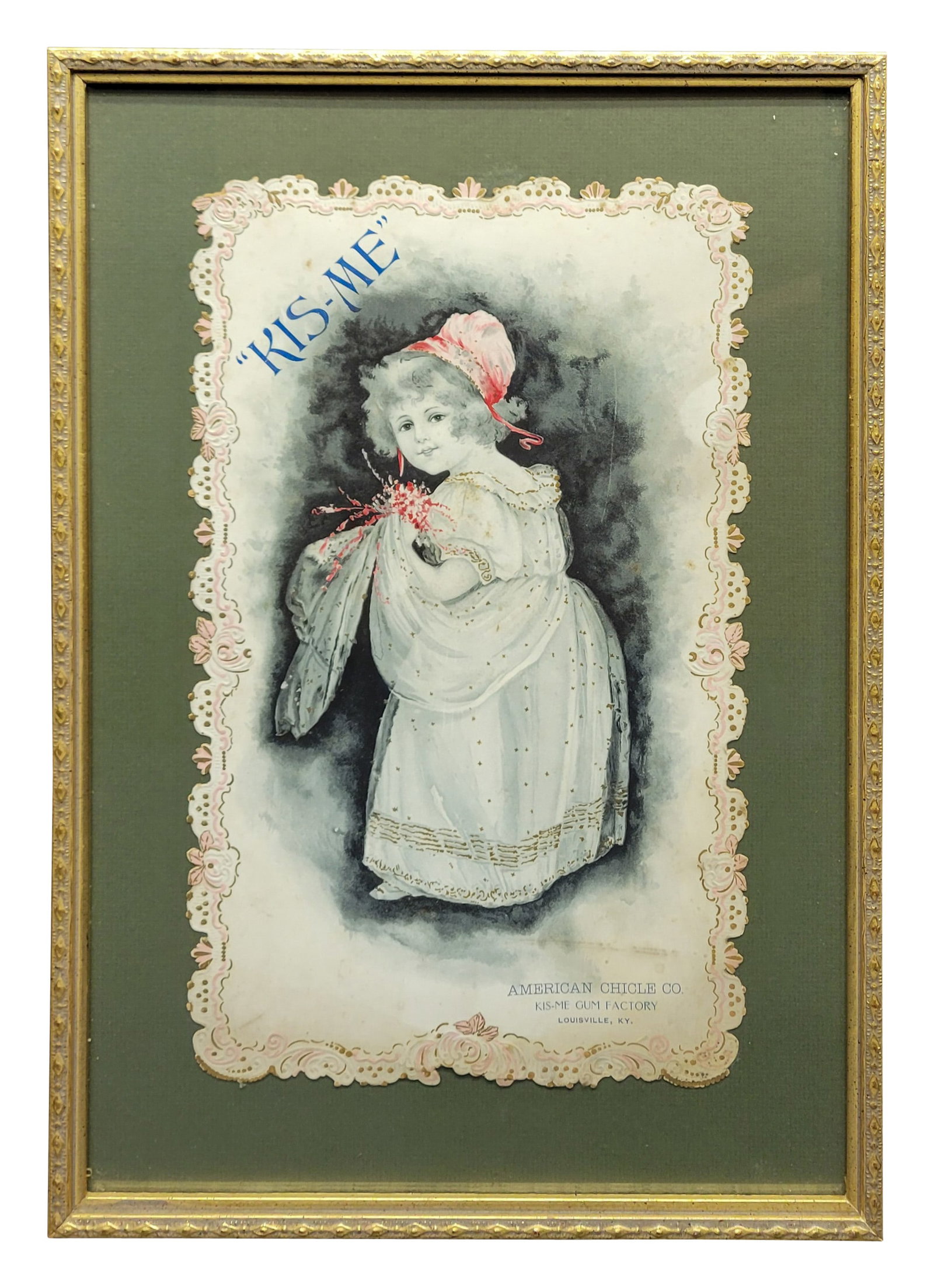 American Chicle Co. Kis-Me Gum Factory Framed Cardboard: 12"x 18", Rare framed under glass early Kis-Me Gum cardboard advertising. The cardboard appears to be in very good condition with detailed edges and graphics. There is a faint discoloration along the 