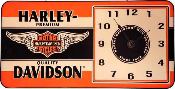 Modern Harley Davidson Motorcycles Light Up Clock: 23.75" x 5" x 12" working modern light-up clock is in satisfactory condition. It features a metal casing with a plastic face. There are several scratches that have been repaired on the left side of th