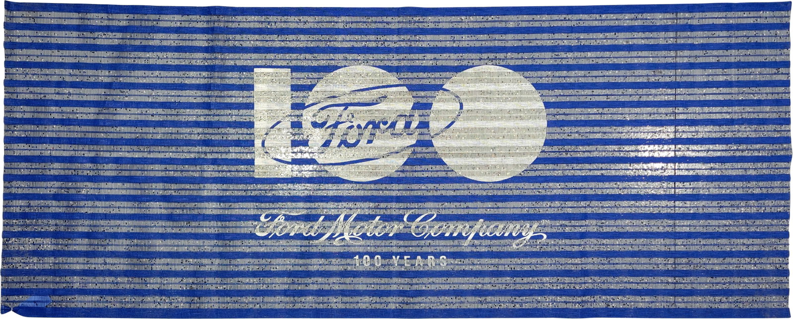 Ford Motor Company 100 Years Banner: 115"w x 47"h single sided vinyl mesh material banner is in excellent condition with bright colors. It celebrates the centennial of Ford Motor Company's founding.