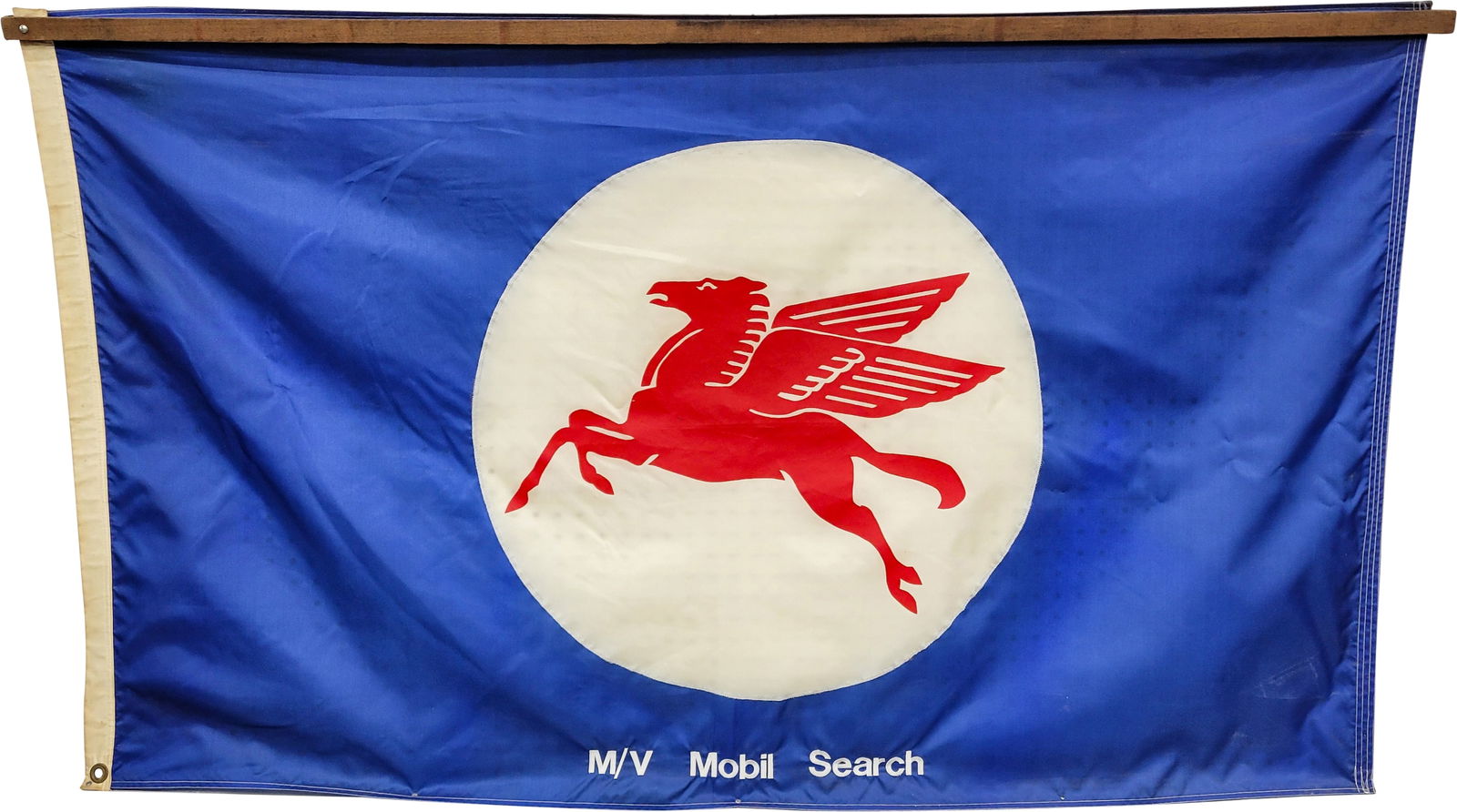 Mobiloil Pegasus Flag: 59" x 36" nylon flag with Pegasus logo. The top edge and bottom edge of the flag have been attached to a frame so that it can hang flat. There are also 2 added hangers along the top. The left side has