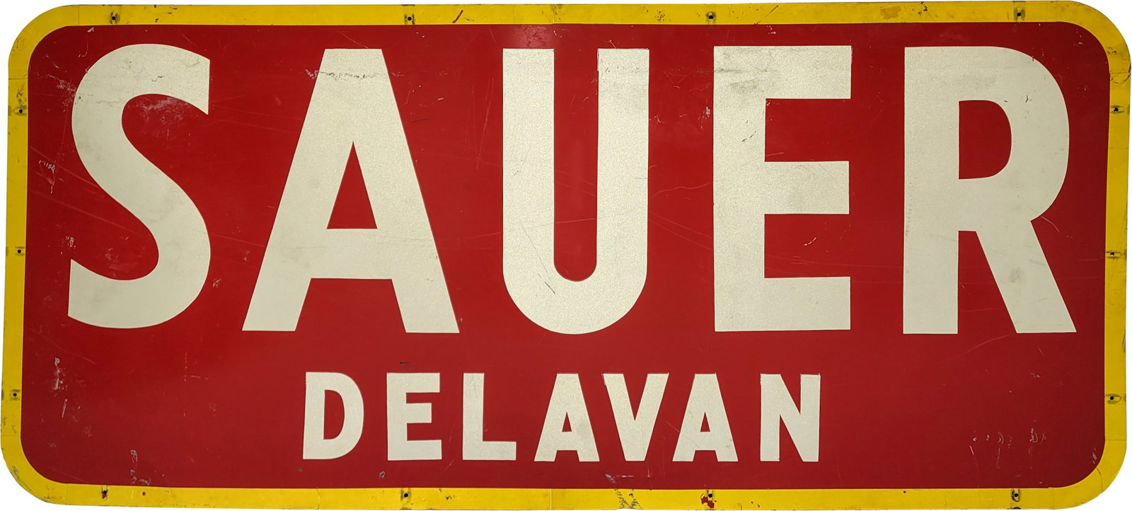 Sauer Delavan DST Sign: 79.5" x 36" large DST sign features reflective lettering and trim on one side with general surface wear and scratches. The opposite side displays notable signs of wear, including deep scratches and ar